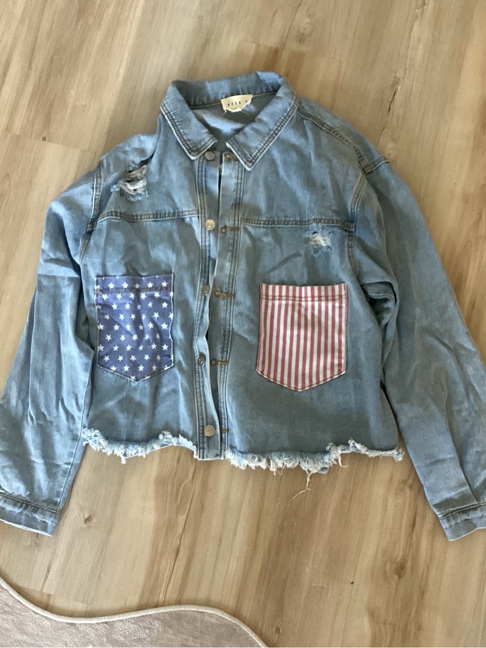 Distressed Light Wash Denim Jacket with American Flag Pockets